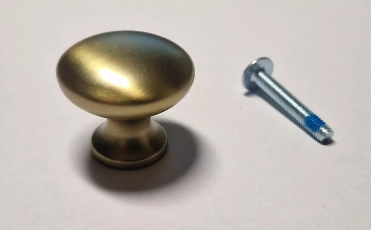 Hardware kit for IKEA furniture. Includes 1 gold-colored HACKÅS knob 10006309, ø 27 mm, and 1 mounting screw 11997. For doors or drawers.