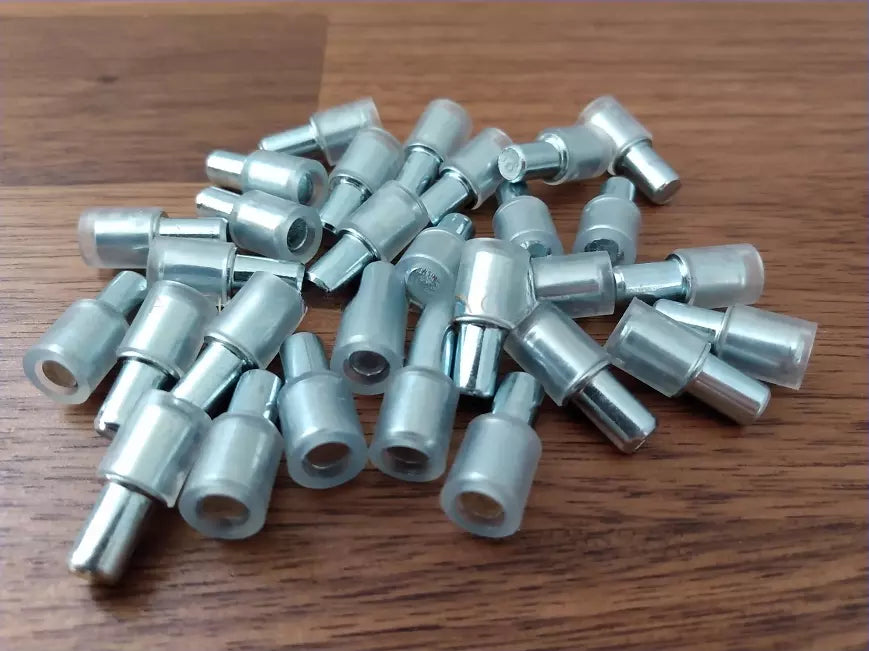 Pack of 12 transparent plastic support pins 101577. Replacement part for glass shelves in IKEA cabinets like DETOLF, BESTÅ, and more.