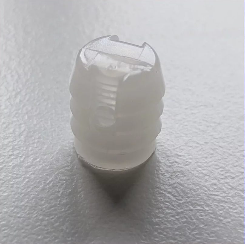 Photo of an IKEA plastic socket 102267 for MALM, HEMNES, BRIMNES beds and many other furniture pieces.
